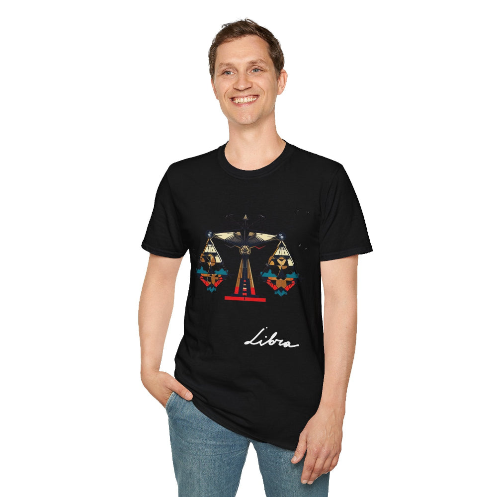Black unisex cotton t-shirt modeled by smiling man with short brown hair, featuring bold Libra zodiac graphic on chest: vibrant abstract scales of justice with balanced arms, intricate geometric triangular motifs, central axis design, symmetrical layout, and dynamic multicolored paint splatters in gold, red, navy, teal, and black tones bursting outward. Elegant white cursive "Libra" text below. Astrology zodiac motivational crewneck tee.