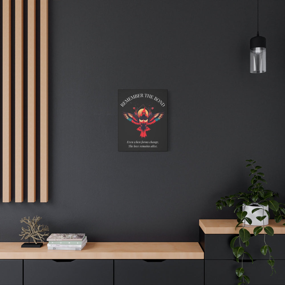 Vibrant phoenix wall art print with the text "REMEMBER THE BOND" and quote "Even when forms change, the love remains alive." Modern minimalist home decor on dark wall.