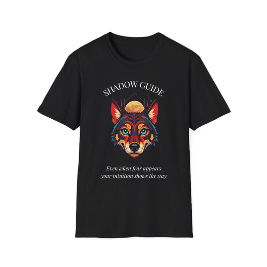 Black unisex cotton t-shirt featuring bold "Shadow Guide" graphic: vibrant abstract wolf head portrait with intense blue-green eyes, colorful geometric accents, and dynamic paint splatters in red, orange, teal, blue, and gold tones bursting outward around an orange moon background. Arched white text "SHADOW GUIDE" above and smaller inspirational quote "Even when fear appears, your intuition shows the way" below. Motivational spiritual empowerment crewneck tee.