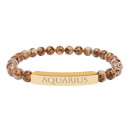 Bracelet with polished leopard jasper beads in earthy brown tones with natural veining, featuring a gold-plated curved bar engraved "AQUARIUS" in uppercase letters. Stretch-fit zodiac-inspired crystal jewelry.