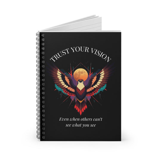 Notebook with a colorful abstract phoenix/eagle with spread wings, intense expression, and paint splatters on a black background, featuring the words "TRUST YOUR VISION" and quote "Even when others can't see what you see".