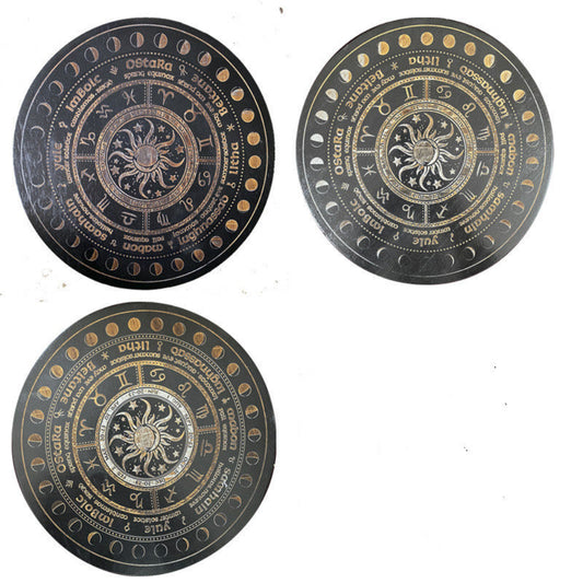 Three black and gold Wheel of the Year divination boards displayed together, each featuring a central sun and moon design, zodiac symbols, sabbat names (Yule, Imbolc, Ostara, Beltane, Litha, Lammas, Mabon, Samhain), and moon phase markers around the edge. Pagan seasonal wheel set.