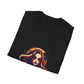 Black folded unisex cotton t-shirt featuring bold "Feral" graphic print: vibrant abstract portrait of a fierce woman with wild flowing horn-like hair, intense red eye makeup and expression, tribal markings, colorful geometric accents, and dynamic paint splatters in red, orange, teal, blue, and gold tones bursting outward around an orange moon background. White elegant cursive "Feral" text below. Wild feminine energy motivational crewneck tee.