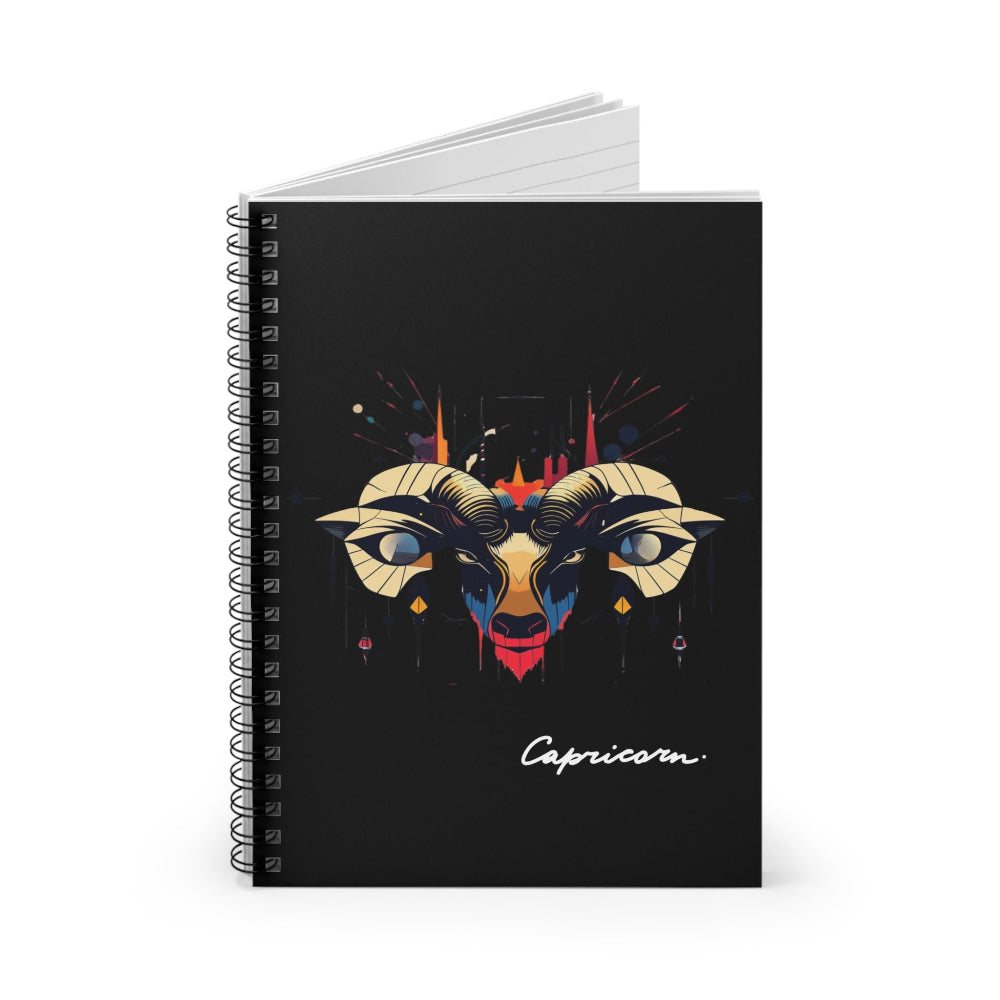 Notebook with a colorful abstract Capricorn goat head portrait, large curved horns, intense eyes, geometric patterns, and paint splatters on a black background, featuring the word "Capricorn" in elegant white cursive.