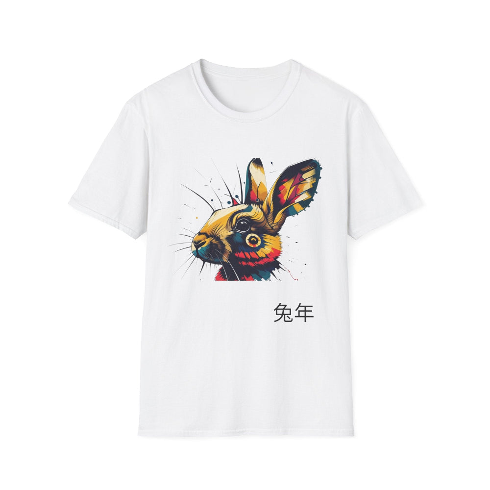 White unisex cotton t-shirt featuring bold Year of the Rabbit graphic: vibrant abstract rabbit face portrait with large expressive ears, intense glowing eyes, geometric patterns, and dynamic multicolored paint splatters in gold, red, blue, teal, orange, and black tones exploding outward. Chinese text "兔年" (Year of the Rabbit) printed below in black. Zodiac Chinese New Year motivational crewneck tee.