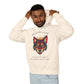 Young man with short hair pulling up the hood of a cream hoodie featuring vibrant multicolored wolf head graphic, intense eyes in orange blue teal splashes, full moon above, "SHADOW GUIDE" arched text, motivational quote about intuition and fear below