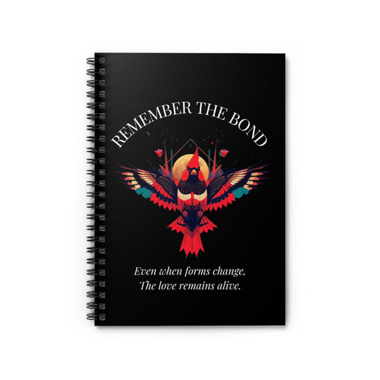 Spiral notebook with 'Remember The Bond' motivational cover design featuring a colorful bird illustration and quote 'Even when forms change, The love remains alive' on a black background.