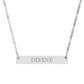 Silver bar necklace with engraved uppercase text "DIVINE" on a sleek matte silver pendant, suspended on a delicate matching silver chain. Minimalist spiritual affirmation jewelry for empowerment and divine connection.