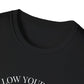 Close-up of black unisex cotton crewneck t-shirt collar: soft ribbed neckline, clean stitching, comfortable fit. Premium durable crew neck construction detail.