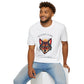White unisex cotton t-shirt modeled by smiling man with curly hair and beard, featuring bold "Shadow Guide" graphic: vibrant abstract wolf head portrait with intense expression, colorful geometric accents, and dynamic paint splatters in red, orange, teal, blue, and gold tones around an orange moon. Arched white text "SHADOW GUIDE" above and smaller quote "Even when fear appears, your intuition shows the way" below. Motivational spiritual empowerment crewneck tee.