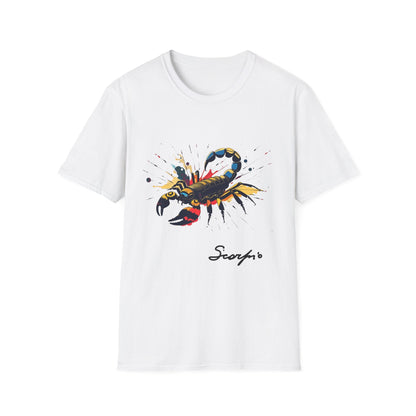 White unisex cotton t-shirt featuring bold Scorpio zodiac graphic: vibrant abstract scorpion silhouette with raised stinger, intense glowing eyes, detailed tail and pincers, geometric patterns, and explosive multicolored paint splatters in gold, red, navy, teal, and black tones bursting outward. Elegant black cursive "Scorpio" text below. Astrology zodiac motivational crewneck tee.