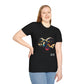 Black unisex cotton t-shirt modeled by smiling plus-size female with long blonde hair, hand on hip, featuring bold Year of the Goat graphic: vibrant abstract goat head portrait with large curved horns, intense expression, geometric patterns, and dynamic multicolored paint splatters in gold, red, black, blue, teal, and orange tones exploding outward. Chinese text "羊年" (Year of the Goat) printed below in white. Zodiac Chinese New Year motivational crewneck tee.