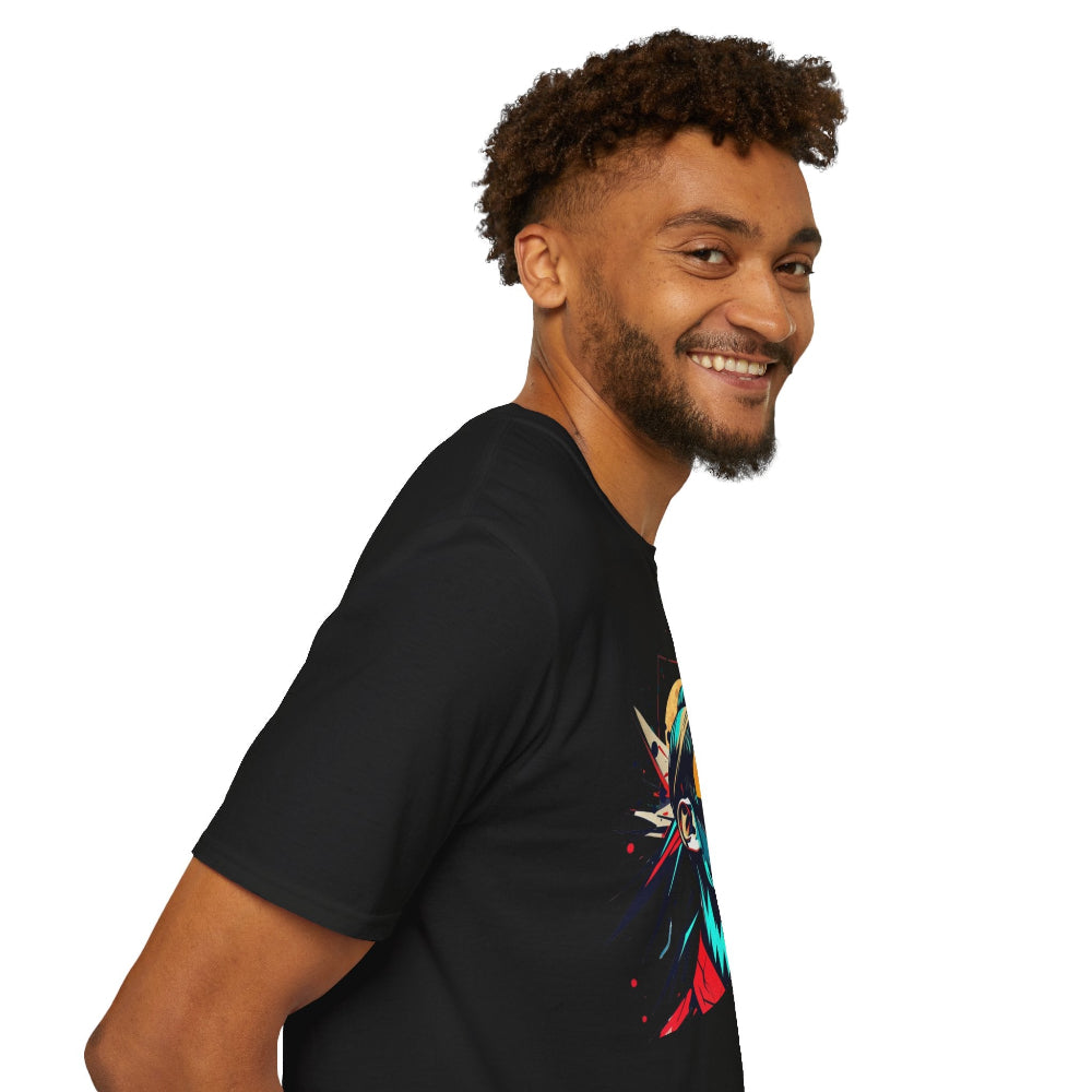 Black unisex cotton t-shirt in side profile on smiling male model with curly hair and beard, featuring bold Primal graphic on chest: stylized intense bearded man portrait with vibrant multicolored geometric shards in red, yellow, teal, and blue exploding outward. Primal masculine energy motivational crewneck tee.