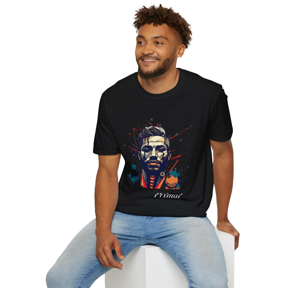 Black unisex cotton t-shirt modeled by smiling man with curly hair and beard, featuring bold "Primal" graphic: stylized intense man portrait with short styled hair, vibrant red, blue, teal, and orange paint splatters bursting outward. Elegant white cursive "Primal" text below. Primal masculine energy motivational crewneck tee.