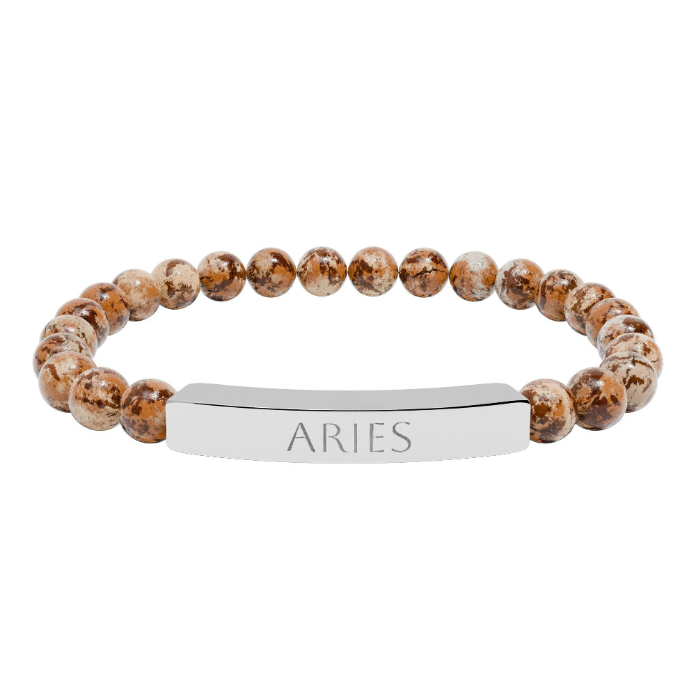 Bracelet with polished leopard jasper beads in earthy brown tones with natural veining, featuring a silver curved bar engraved "ARIES" in uppercase letters. Stretch-fit zodiac-inspired crystal jewelry for passion, courage, and leadership.