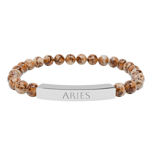 Bracelet with polished leopard jasper beads in earthy brown tones with natural veining, featuring a silver curved bar engraved "ARIES" in uppercase letters. Stretch-fit zodiac-inspired crystal jewelry for passion, courage, and leadership.