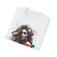 White folded unisex cotton t-shirt featuring bold "Feral" graphic print: vibrant abstract portrait of a fierce woman with wild flowing hair, intense expression, tribal markings, colorful geometric accents, and dynamic paint splatters in red, orange, teal, blue, and gold tones bursting outward around an orange moon background. White elegant cursive "Feral" text below. Wild feminine energy motivational crewneck tee.