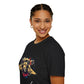 Black unisex cotton t-shirt in side profile on smiling woman with braided hair, featuring bold Leo zodiac graphic on chest: vibrant abstract lion head portrait with powerful flowing mane, fierce intense eyes, regal expression, geometric accents, and dynamic multicolored paint splatters in gold, red, navy, teal, and black tones exploding outward. Elegant white cursive "Leo" text below. Astrology zodiac motivational crewneck tee.