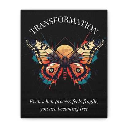 Close up of black canvas wall art print of colorful abstract butterfly with detailed wings, geometric accents, and cosmic splatters on dark background, arched text "TRANSFORMATION" above and quote "Even when process feels fragile, you are becoming free" below. 