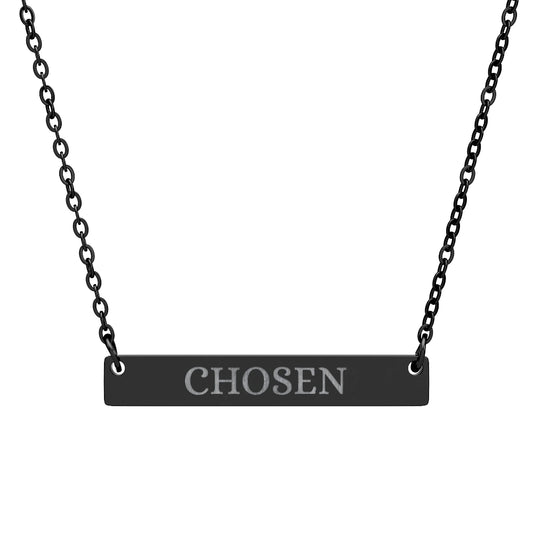 Black bar necklace with engraved uppercase text "CHOSEN" on a matte black pendant, suspended on a delicate black chain. Minimalist motivational jewelry for affirmation, empowerment, and self-worth.