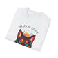 White folded unisex cotton t-shirt featuring bold "Shadow Guide" graphic: vibrant abstract wolf head portrait with intense turquoise eyes, colorful geometric accents, and dynamic paint splatters in red, orange, teal, blue, and gold tones bursting outward around an orange moon background. Arched white text "SHADOW GUIDE" above. Motivational spiritual empowerment crewneck tee flat lay.