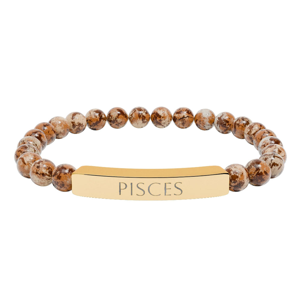 Bracelet with polished leopard jasper beads in earthy brown tones with natural veining, featuring a gold-plated curved bar engraved "PISCES" in uppercase letters. Stretch-fit zodiac-inspired crystal jewelry.