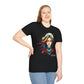 Black plus-size unisex cotton t-shirt modeled by smiling woman with long blonde hair, hand on hip, featuring bold "Feral" graphic on chest: vibrant abstract portrait of a fierce woman with wild flowing multicolored hair, intense expression, tribal markings, colorful geometric accents, and dynamic paint splatters in red, orange, teal, blue, and gold tones bursting outward around an orange moon background. White elegant cursive "Feral" text below. Wild feminine energy motivational crewneck tee.