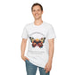 White unisex cotton t-shirt modeled by smiling man with short brown hair, featuring bold "Transformation" graphic: vibrant abstract butterfly with detailed wings, intense expression, colorful geometric accents, and dynamic paint splatters in red, orange, teal, blue, and gold tones around an orange moon. Arched white text "TRANSFORMATION" above and smaller quote "Even when the process feels fragile, you are becoming free" below. Motivational spiritual empowerment crewneck tee.