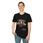 Black unisex cotton t-shirt modeled by smiling man with short brown hair, featuring bold Leo zodiac graphic: vibrant abstract lion head portrait with powerful flowing mane, fierce intense eyes, regal expression, geometric accents, and dynamic multicolored paint splatters in gold, red, navy, teal, and black tones exploding outward. Elegant white cursive "Leo" text below. Astrology zodiac motivational crewneck tee.