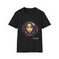 Black unisex cotton t-shirt featuring bold "Feral" graphic: vibrant abstract portrait of a fierce woman with wild flowing hair in blue and red tones, intense expression, tribal markings and forehead jewel, colorful geometric accents, and dynamic paint splatters bursting outward around an orange moon background. White elegant cursive "Feral" text below. Wild feminine energy motivational crewneck tee.