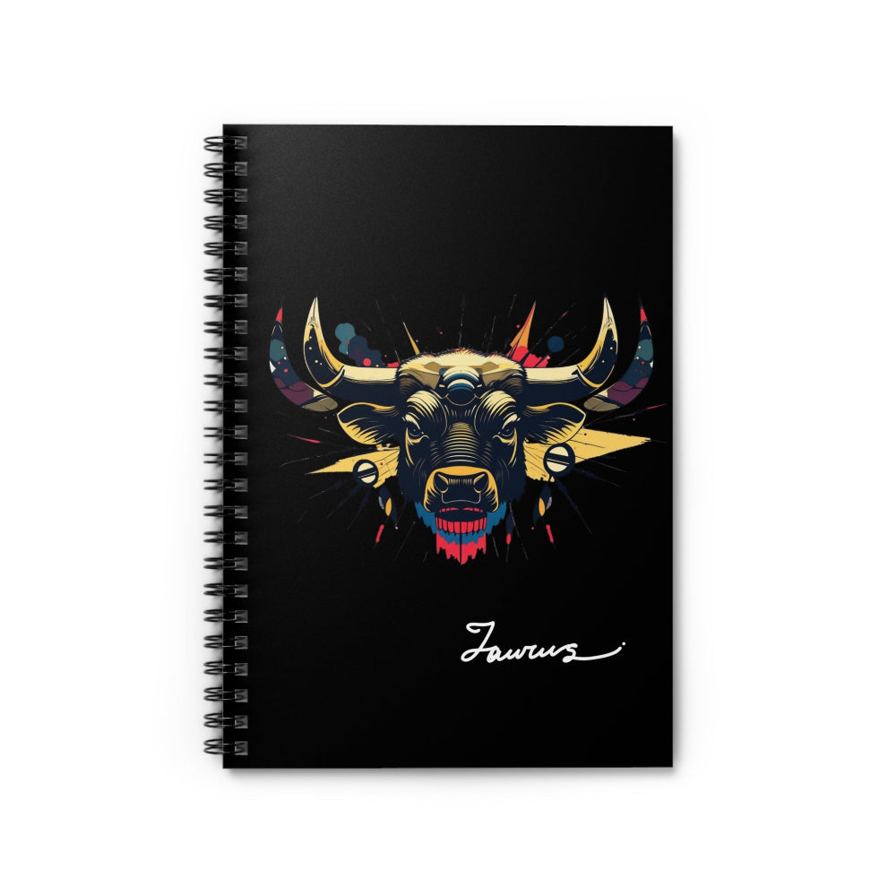 Close up of notebook with a colorful abstract Taurus bull head portrait, large curved horns, intense expression, and paint splatters on a black background, featuring the word "Taurus" in elegant white cursive.