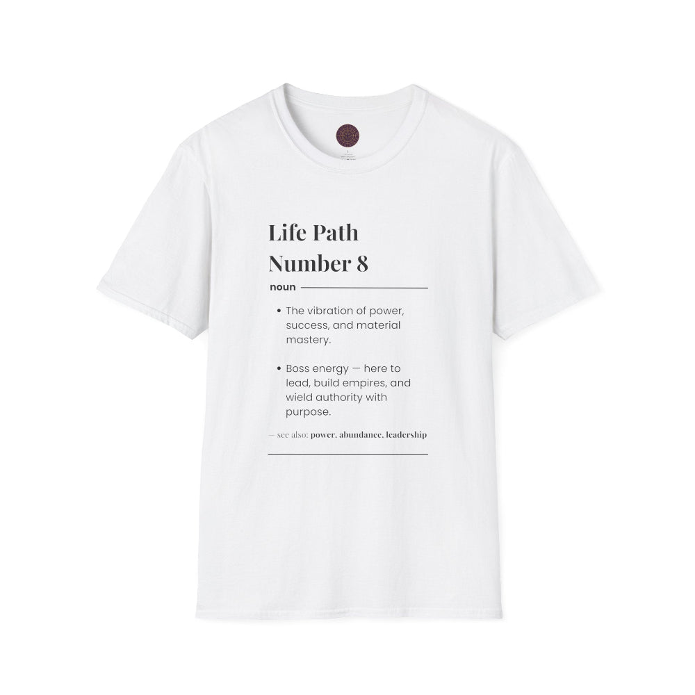 White unisex cotton t-shirt featuring bold Life Path Number 8 numerology print: dictionary-style definition text reading "Life Path Number 8 noun The vibration of power, success, and material mastery. Boss energy — here to lead, build empires, and wield authority with purpose. — see also: power, abundance, leadership". Motivational spiritual numerology crewneck tee flat lay with visible purple/gold zodiac wheel inner tag.
