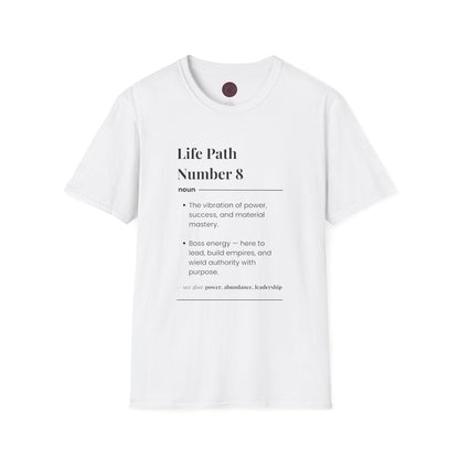 White unisex cotton t-shirt featuring bold Life Path Number 8 numerology print: dictionary-style definition text reading "Life Path Number 8 noun The vibration of power, success, and material mastery. Boss energy — here to lead, build empires, and wield authority with purpose. — see also: power, abundance, leadership". Motivational spiritual numerology crewneck tee flat lay with visible purple/gold zodiac wheel inner tag.
