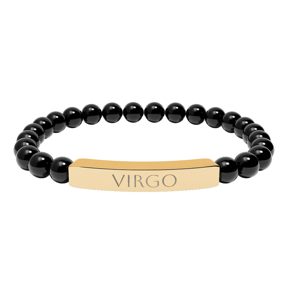 Bracelet with polished black onyx beads and gold-plated curved bar engraved "VIRGO" in uppercase letters. Stretch-fit zodiac-inspired crystal jewelry.