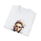 White folded unisex cotton t-shirt featuring bold Primal graphic print: stylized bearded man portrait with short styled hair, intense gaze, red accent on nose, and vibrant red, teal, black abstract paint splatters bursting outward. Primal masculine energy motivational crewneck tee.