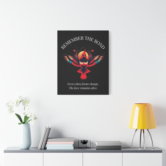 Modern minimalist interior with a dark wall poster featuring a colorful geometric bird and the quote ‘Remember the Bond – Even when forms change, the love remains alive,’ displayed above a shelf with books, a white orchid vase, and a yellow table lamp.