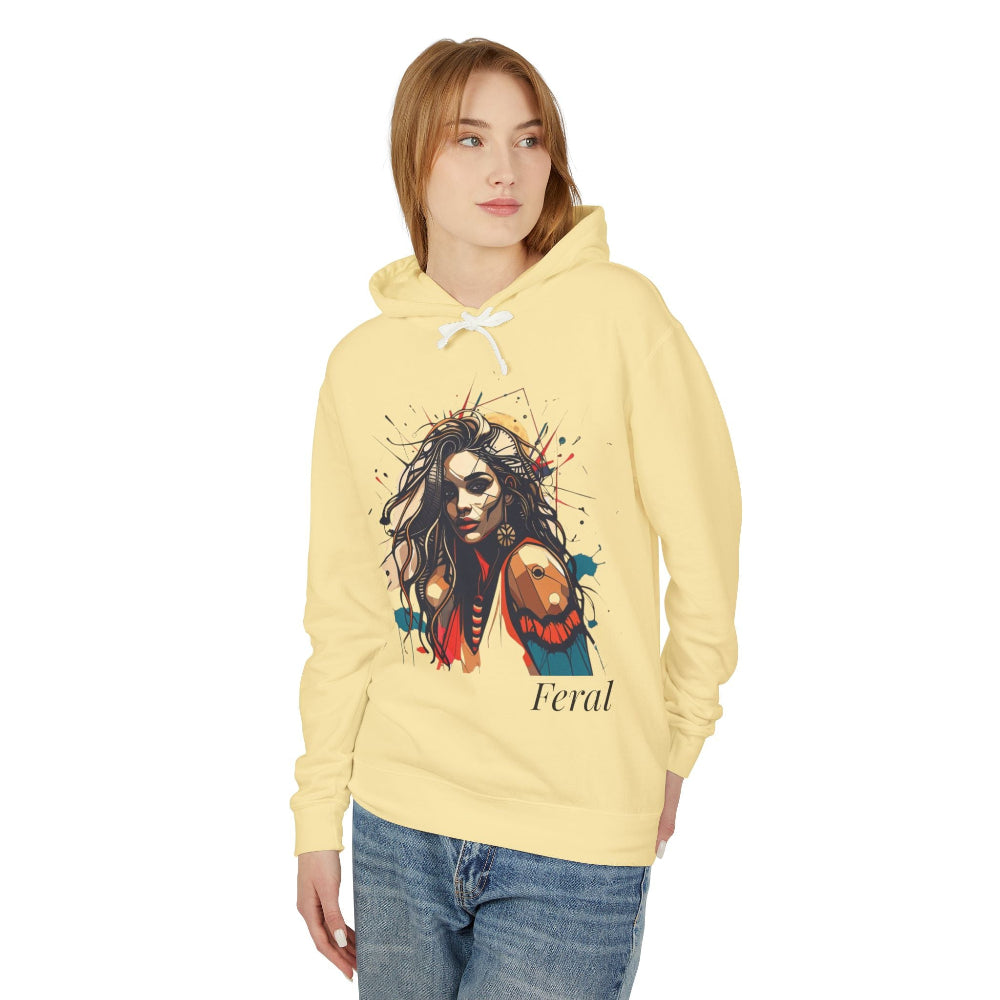Woman in pale yellow feral hoodie, colorful wild woman with wolf graphic and "Feral" text