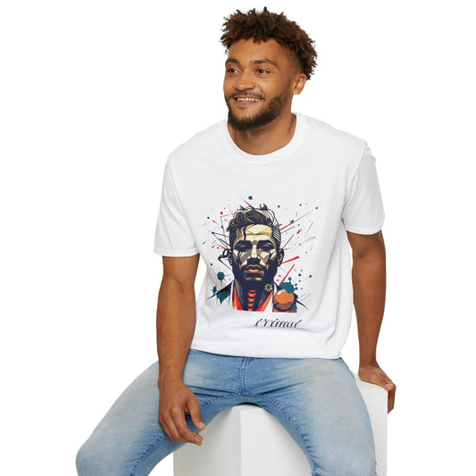 White unisex cotton t-shirt modeled by smiling man with curly hair and beard, hand in pocket, featuring bold "Primal" graphic on chest: stylized intense male portrait with stylish hair, vibrant multicolored geometric face in red, orange, teal, blue and gold tones, dynamic paint splatters and abstract shards exploding outward. Elegant white cursive "Primal" text below. Primal masculine energy motivational crewneck tee.