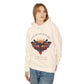 Young woman with long hair modeling cream hoodie featuring vibrant multicolored moth/butterfly graphic, geometric sun/moon elements, "FOLLOW YOUR LIGHT" arched text above, motivational quote "Even when others can't see where you're going" below