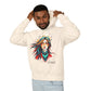Young man with short hair pulling up the hood of a white hoodie featuring vibrant artistic print of a fierce woman with long flowing hair, red-orange armored top, colorful paint splash design, "Feral" text below