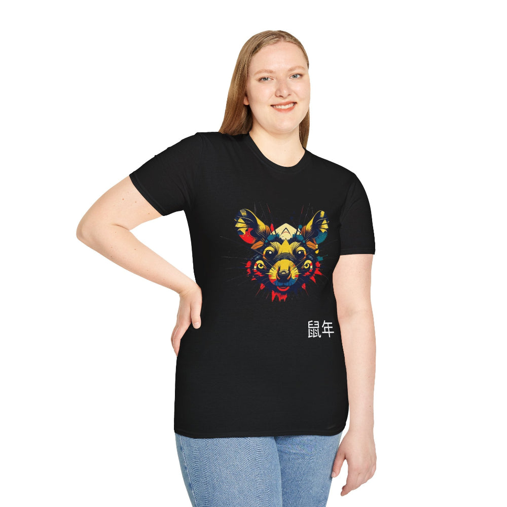 Black unisex cotton t-shirt modeled by smiling plus-size female with long brown hair, hands on hips, featuring bold Year of the Rat graphic: vibrant abstract rat face portrait with large ears, intense eyes, geometric patterns, and multicolored paint splatters in yellow, red, blue, teal, and orange tones. Chinese text "鼠年" (Year of the Rat) printed below in white. Zodiac Chinese New Year motivational crewneck tee.