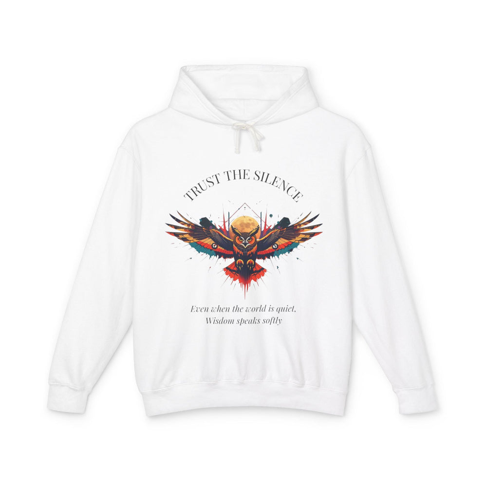 White hoodie with colorful owl graphic, "TRUST THE SILENCE" text and quote "Even when the world is quiet, wisdom speaks softly"