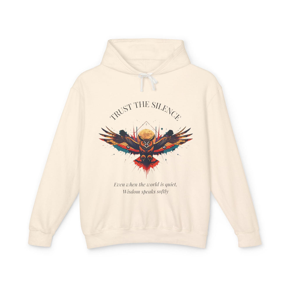 Cream hoodie with colorful owl graphic, "TRUST THE SILENCE" text and quote "Even when the world is quiet, wisdom speaks softly"