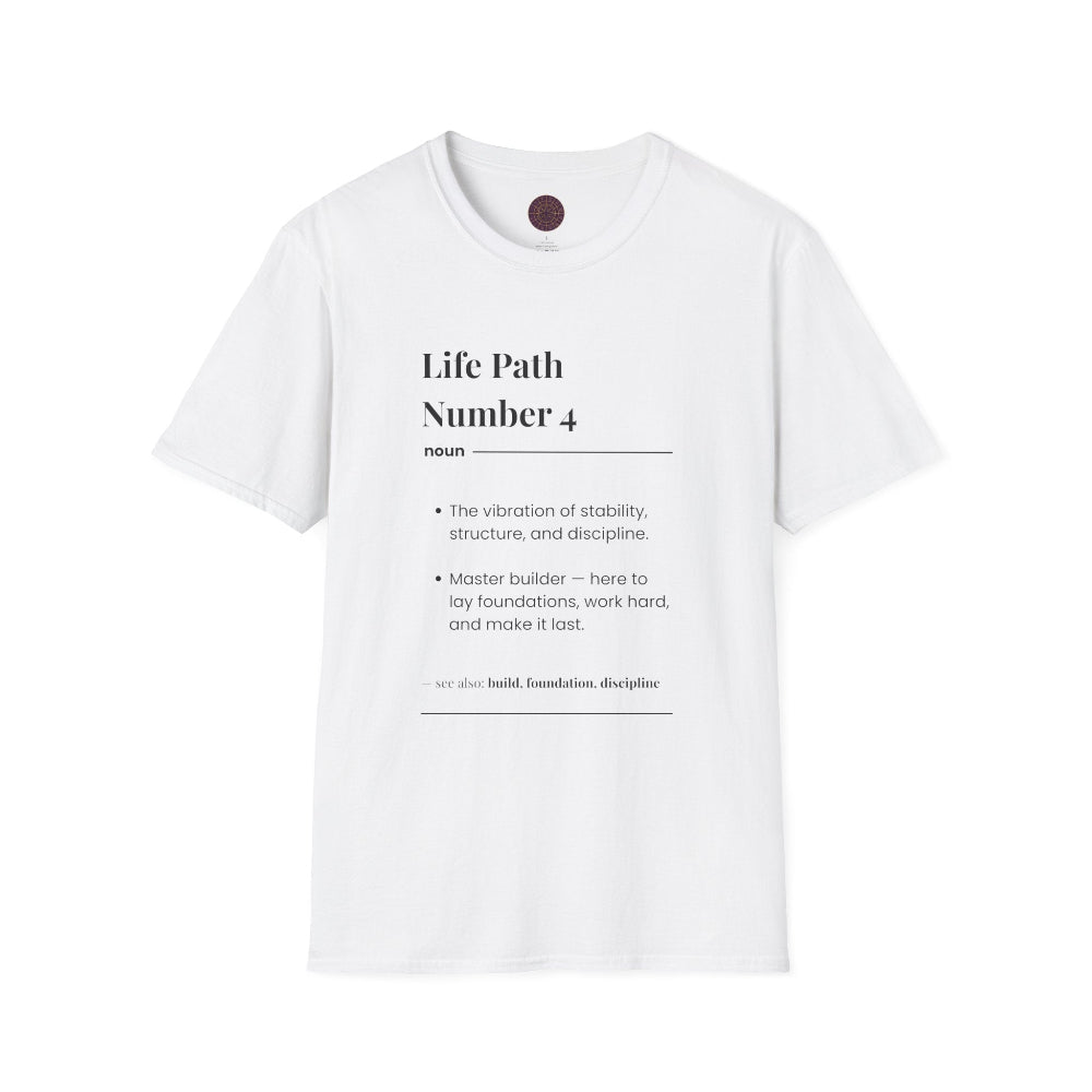 White unisex cotton t-shirt laid out flat featuring bold Life Path Number 4 numerology print in dictionary style: exact text reading "Life Path Number 4 noun The vibration of stability, structure, and discipline. Master builder — here to lay foundations, work hard, and make it last. – see also: build, foundation, discipline". Motivational spiritual numerology crewneck tee flat lay with visible purple/gold zodiac wheel inner tag.