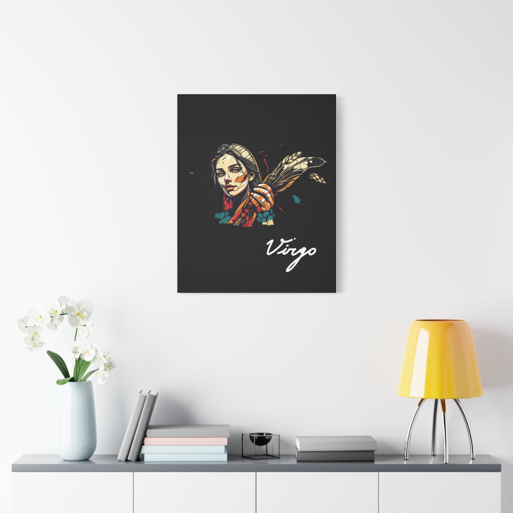 Black canvas wall art print of colorful abstract Virgo woman holding wheat sheaf, serene expression, stylish hair, and cosmic splatters on dark background, featuring "Virgo" in elegant white cursive displayed in a modern home décor setting above a console table with books and yellow lamp.