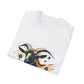 White folded unisex cotton t-shirt featuring bold Year of the Goat zodiac graphic print: vibrant abstract goat / ram head portrait with large curved horns, intense glowing eyes, geometric diamond accents, and dynamic multicolored paint splatters in gold, red, blue, teal, orange, and black tones exploding outward. Chinese text "羊年" (Year of the Goat) printed below in black. Chinese New Year zodiac motivational crewneck tee.