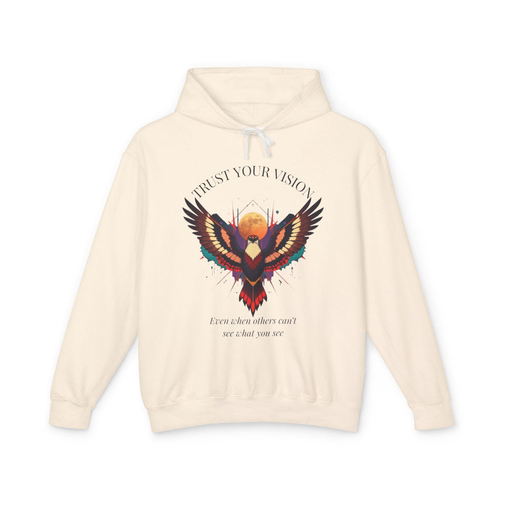 Cream hoodie featuring colorful abstract eagle/phoenix graphic with moon background, "TRUST YOUR VISION" arched above, and inspirational quote "Even when others can't see what you see" below