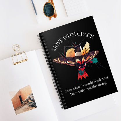 Lifestyle shot of the "Move With Grace" hummingbird notebook on a bright, modern desk. Perfect for a workspace or morning journaling routine.