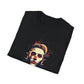 Black folded unisex cotton t-shirt featuring bold Primal graphic print: stylized intense bearded man portrait with short styled hair, red clown nose accent, vibrant multicolored geometric shards in red, teal, orange, and blue tones, dynamic paint splatters exploding outward. Primal masculine energy motivational crewneck tee.