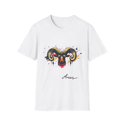 White unisex cotton t-shirt featuring bold Aries zodiac graphic: vibrant abstract ram head portrait with large curved horns, intense expression, geometric patterns, and dynamic multicolored paint splatters in gold, red, navy, teal, and black tones exploding outward. Elegant black cursive "Aries" text below. Astrology zodiac motivational crewneck tee.